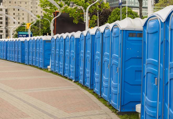 portable restrooms with sink and hand sanitizer stations, available at a festival in Beloit, OH